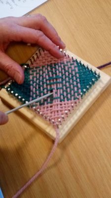 weaving on a pin loom or quilt loom